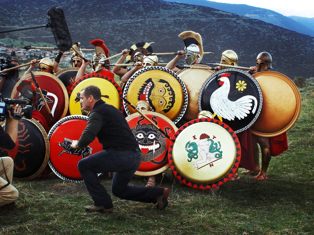 Living-history warriors preparing with reconstructed shields