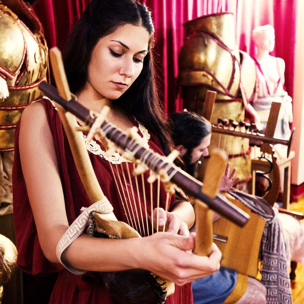 Musician playing a reconstructed ancient instrument