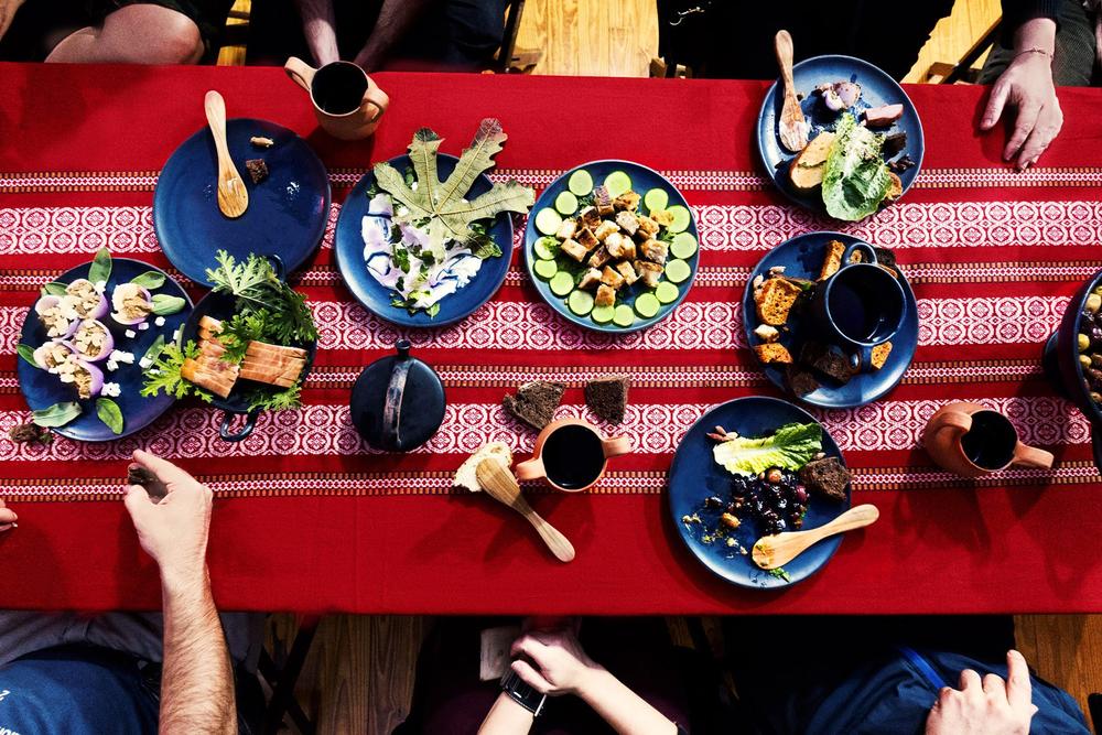 Archaeopolis historical symposium table with reconstructed vessels and food