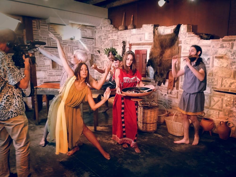 Female dancer performing inside an inhabited historical interior during filming