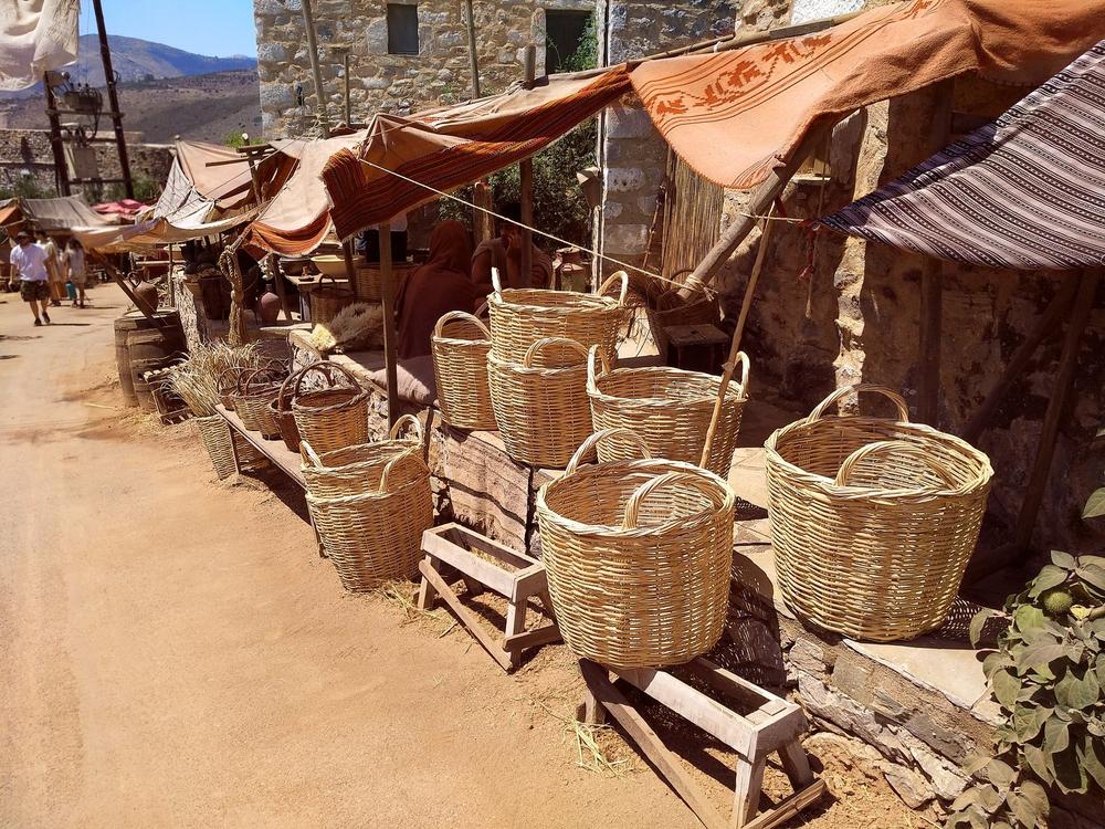 Historical market street set lined with handmade woven baskets