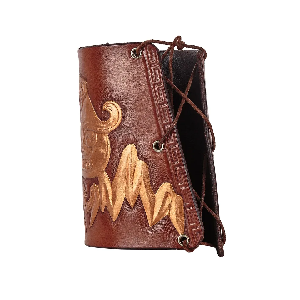 Brown leather bracer with gold-coloured face decoration and side lacing on a white background