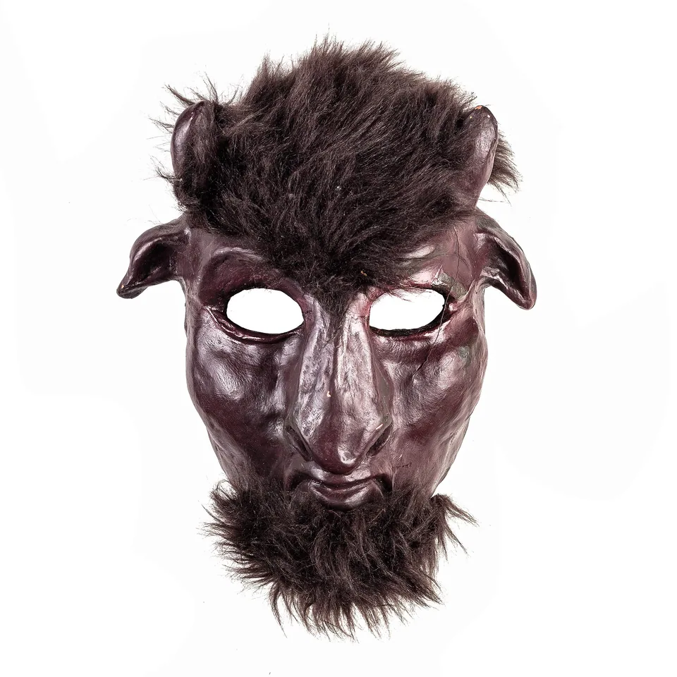 Dark satyr-style mask with small horns, pointed ears, dark hair and a beard