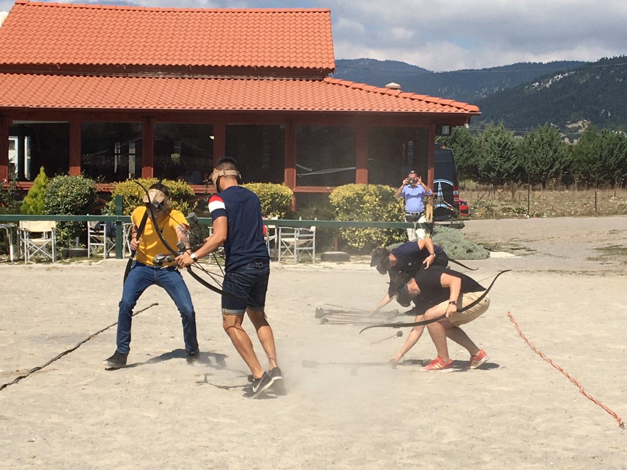 Team game at the ancient-games arena | Archaeopolis Archery Games Participants beginning a team physical game in an open arena