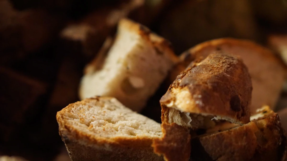 Pieces of crusty bread with a golden crust and pale crumb.