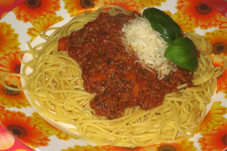 The unpretentious midnight plate Plate of spaghetti Bolognese illustrating the midnight buffet dish
