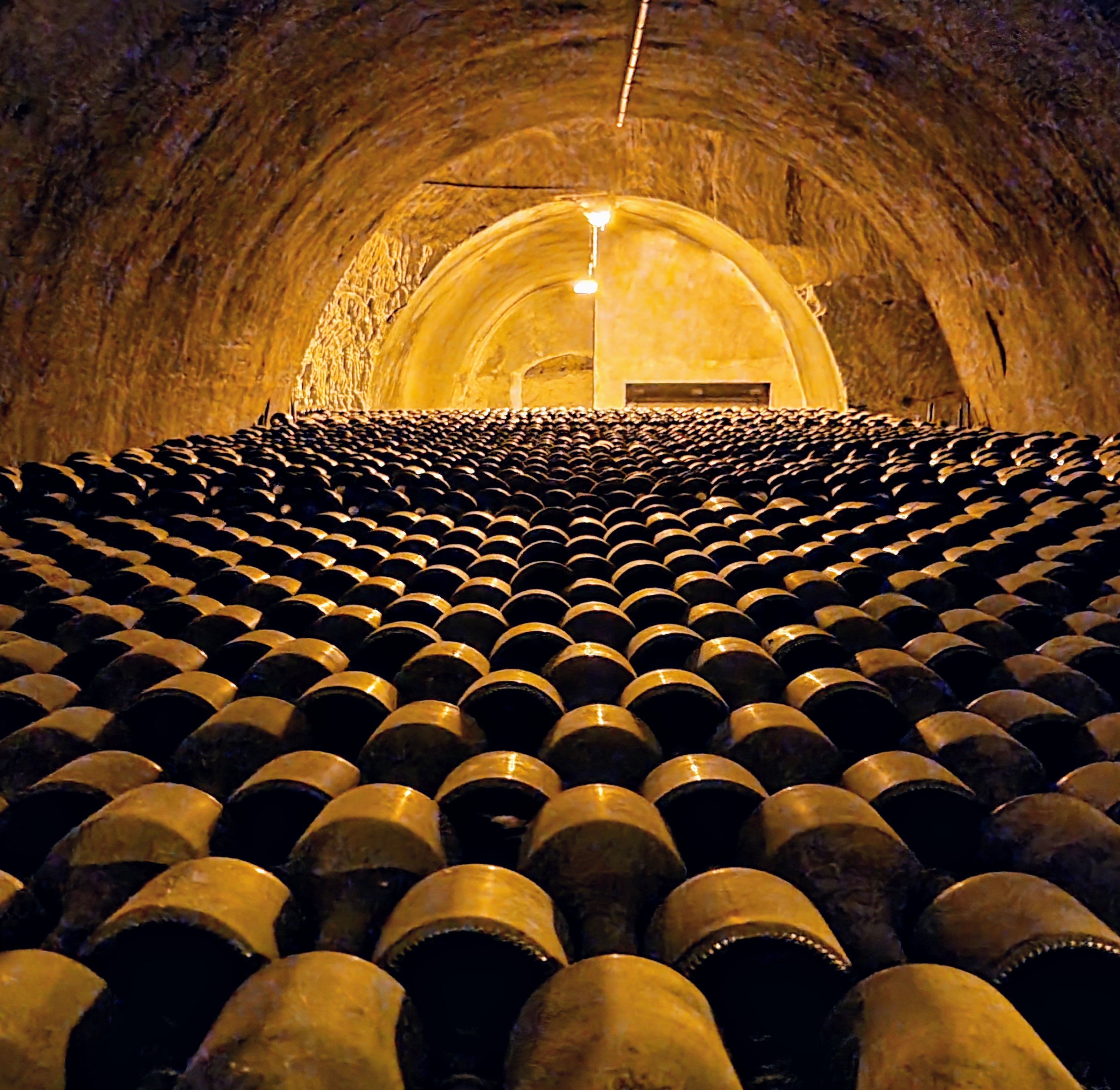 The Champagne behind the name Rows of Champagne bottles ageing in the Taittinger cellars in Reims