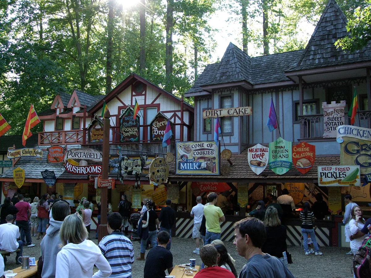 Visitors moving through food and service areas at the Maryland Renaissance Festival