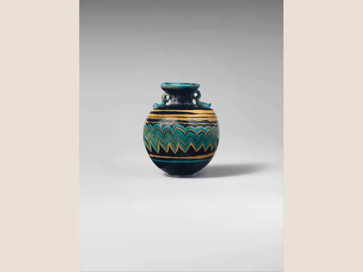 Small cobalt-blue ancient Greek glass aryballos made to hold perfume or scented oil