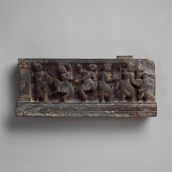 Dionysian Musicians and Dancers in Gandharan Art Gandharan stone stair riser carved with a Dionysian scene of musicians and dancers