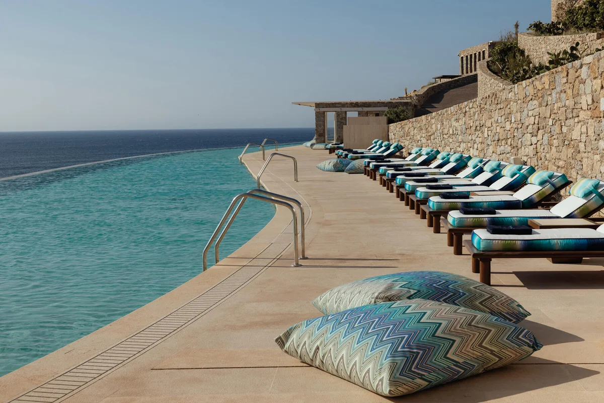 Cali Mykonos infinity pool styled with Missoni Resort Club textiles