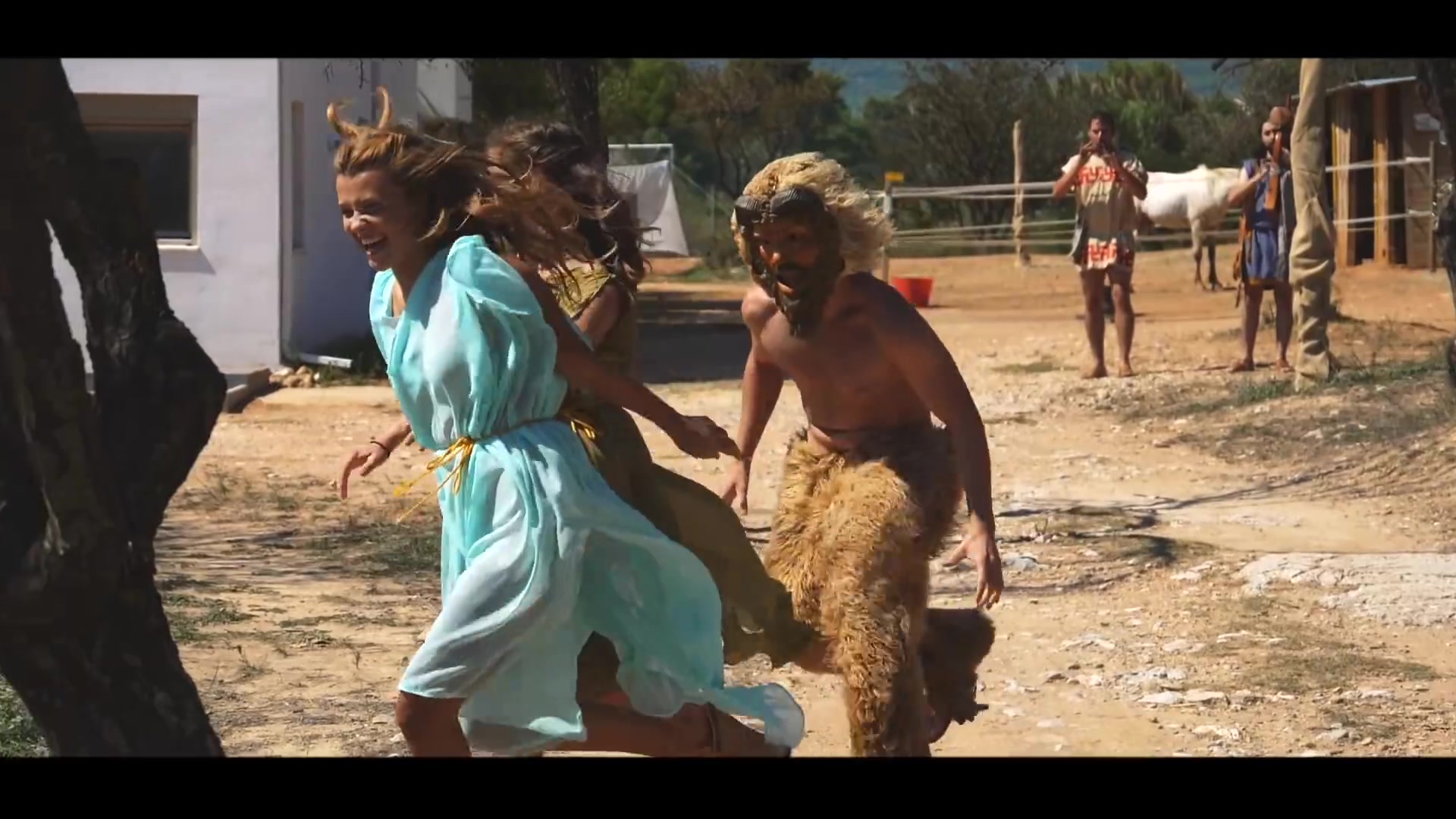 Pan character pursuing women in an outdoor performance