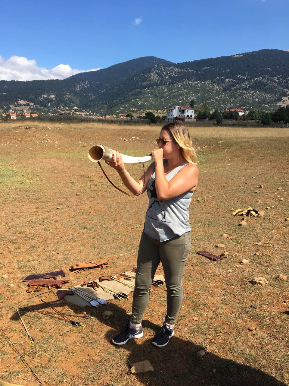 Participant sounding a reconstructed-style horn