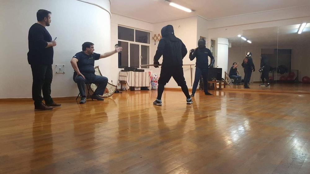 Classroom Technique Review | Athens Hoplites Project Instructor reviewing sword technique with students in the training hall