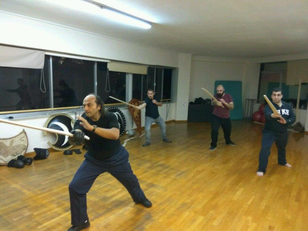 Curved Blade Practice | Athens Hoplites Project Student practising controlled movement with a curved training blade