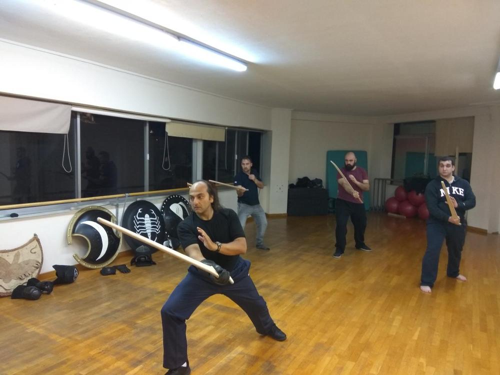 Forward Sword Guard | Athens Hoplites Project Student holding a forward sword guard during class