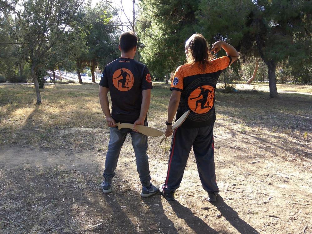 Outdoor Club Shirts Back | Athens Hoplites Project Back view of Athens Hoplites shirts showing the orange Minotaur emblem