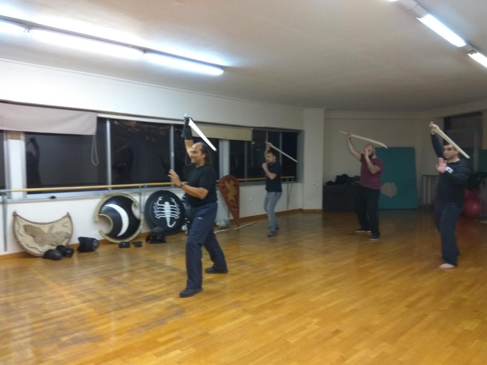 Overhead Sword Drill | Athens Hoplites Project Students repeating an overhead sword cut in formation