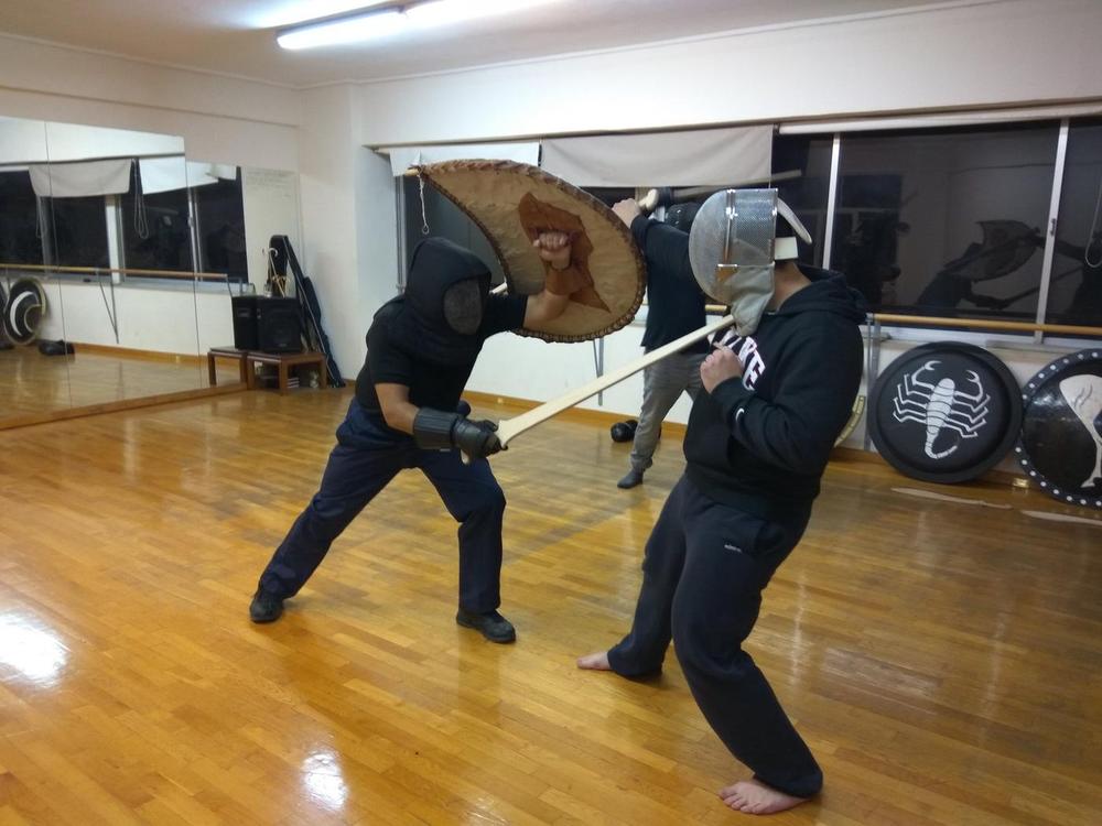 Shield Sword Sparring | Athens Hoplites Project Two students sparring with reconstructed shields and practice swords