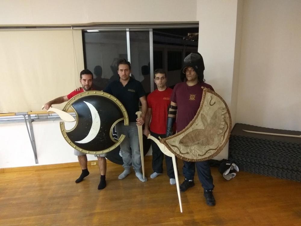 Training Group Shields | Athens Hoplites Project Training group holding reconstructed shields and practice swords