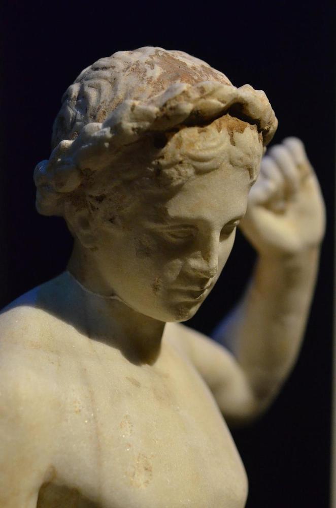 Reclining Youth Statue Detail | Athens Hoplites Project Close detail of the head and upper body of an ancient reclining youth statue