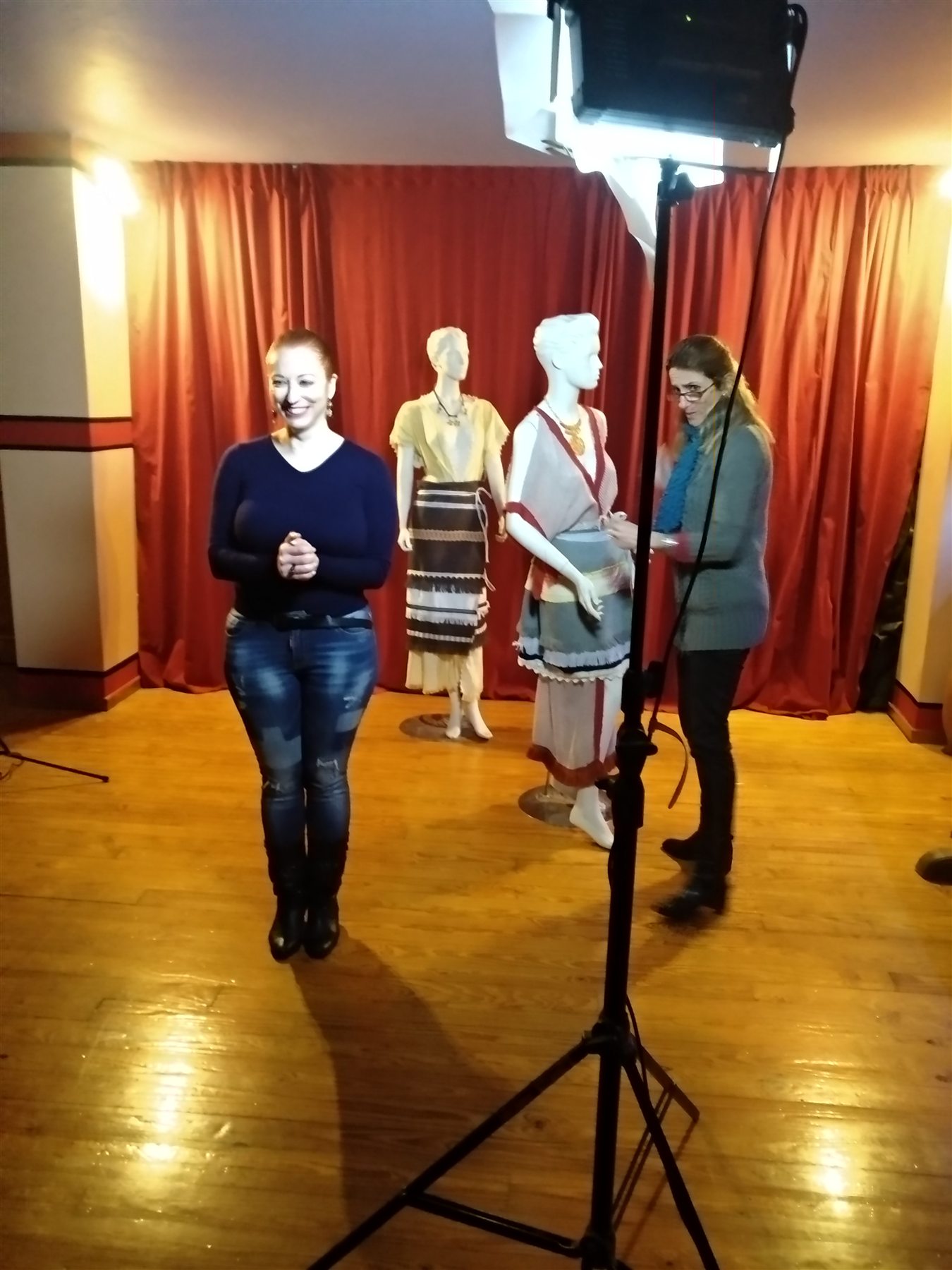 COSMOTE Ancient Greek Dress filming — 007 Camera-ready composition with a presenter and two reconstructed ancient Greek dress displays