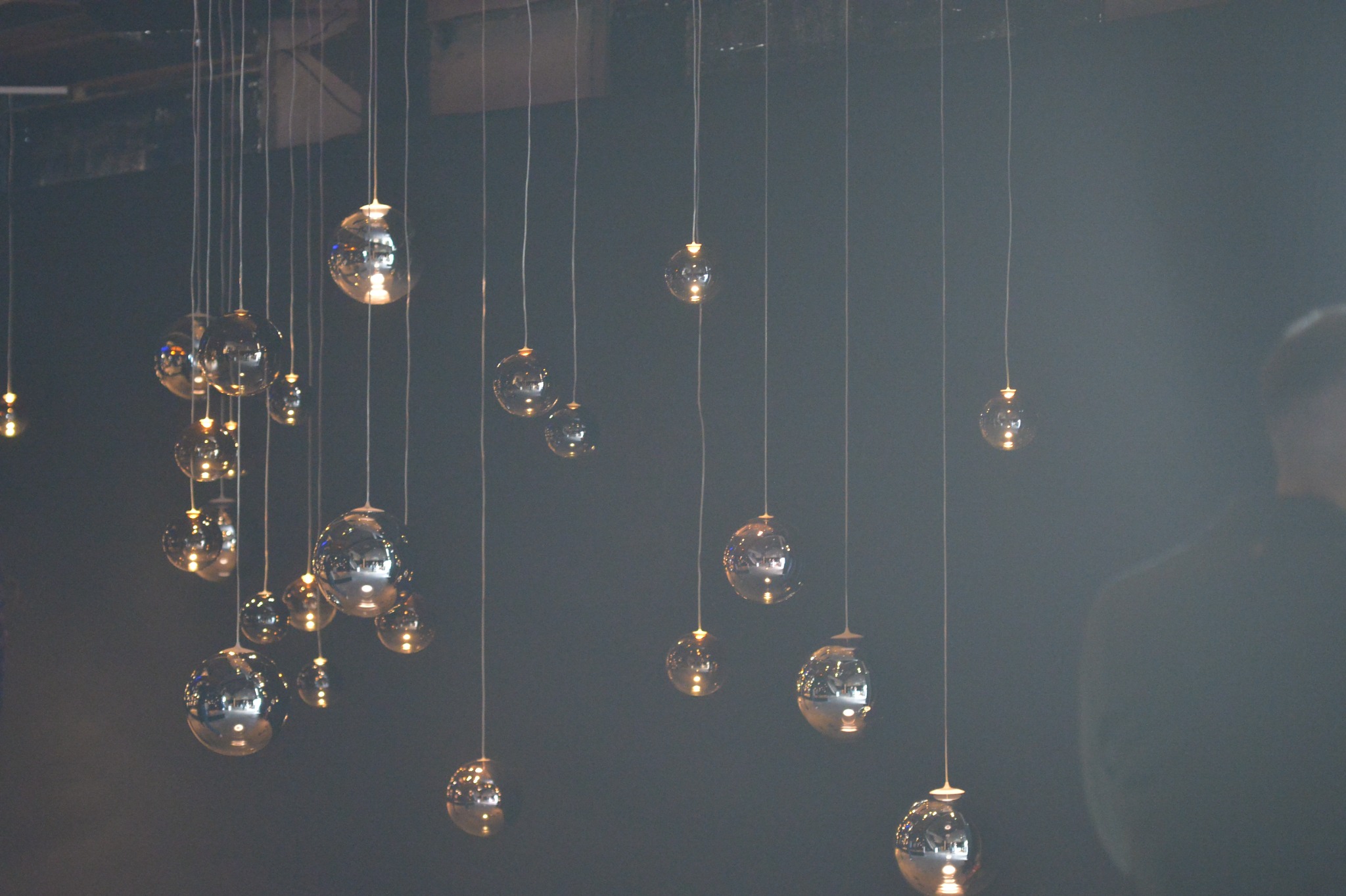Wide view of the suspended glass lighting installation in Mykonos