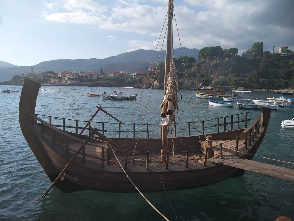 Olkas Afloat | Archaeopolis Olkas Ship Side view of the Archaeopolis Olkas ship floating in clear coastal water