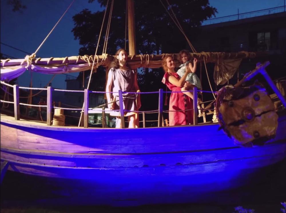 Night Performance on Deck | Archaeopolis Olkas Ship Performers on the illuminated Olkas ship during a night event