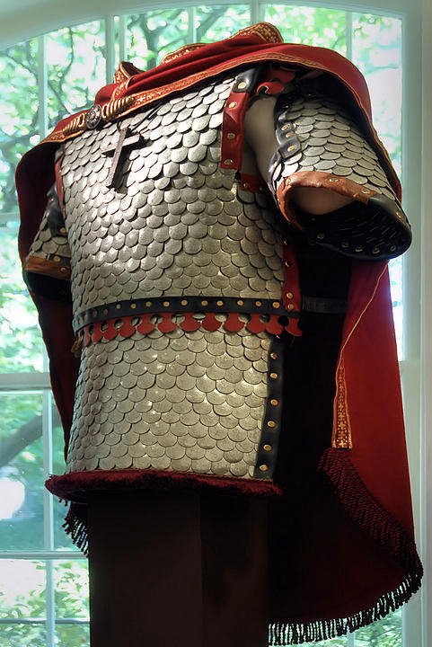 Scale armour interpretation with a red mantle and belt.