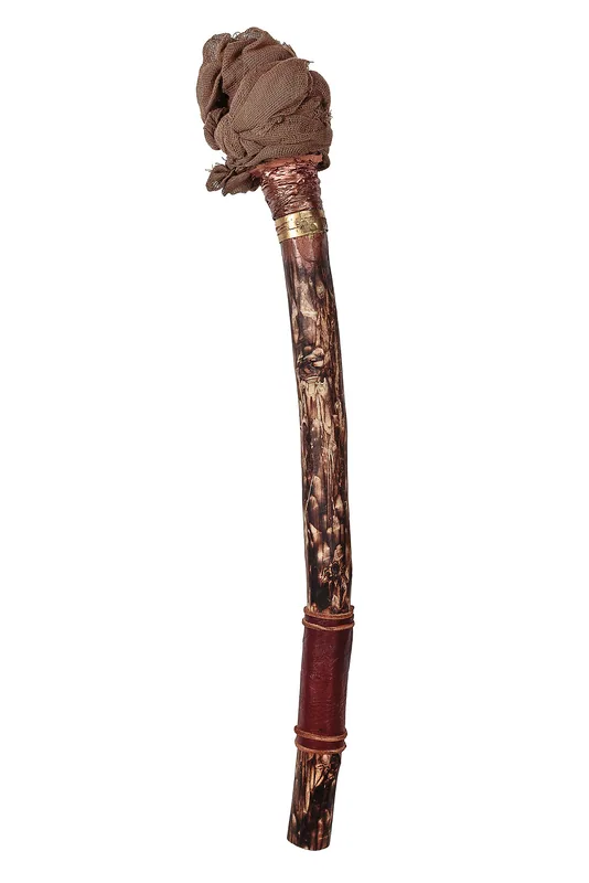 Unlit handheld torch prop with a textured wooden shaft, leather grip and wrapped fabric head