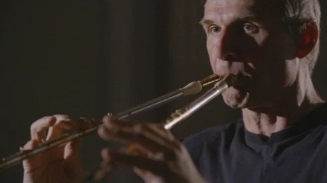 A musician playing a reconstructed double-pipe instrument in Music of Ancient Greece