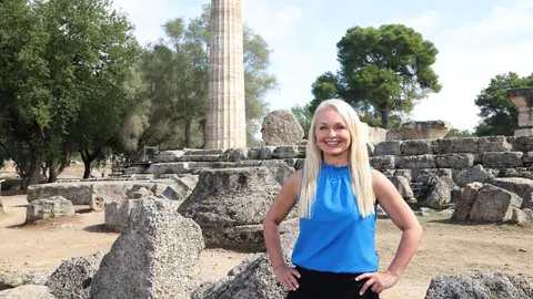 Curious Greece episode image showing host Christine van Blokland at ancient Olympia