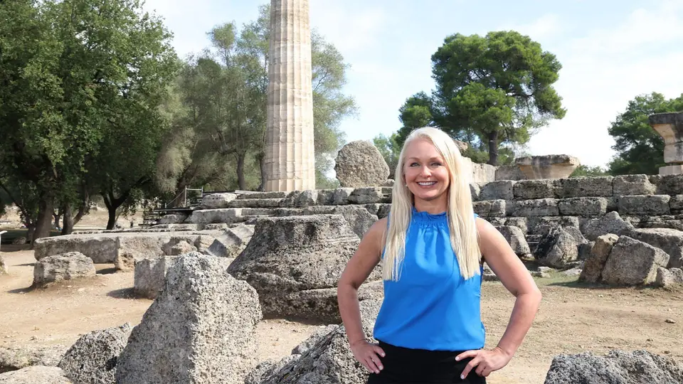 Curious Greece episode image showing host Christine van Blokland at ancient Olympia