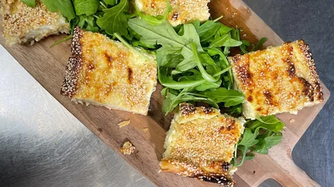 Eat Like Ancient Greek Gods episode image showing cheese pie with green salad