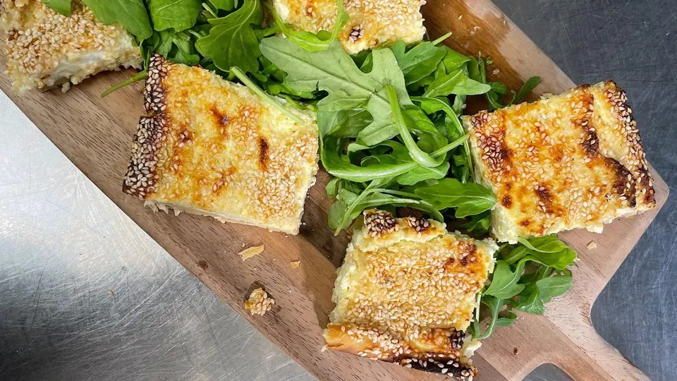 Eat Like Ancient Greek Gods episode image showing cheese pie with green salad